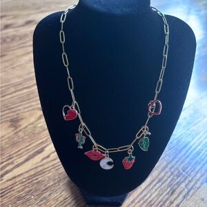 Gold Plated Charm Necklace with Red and Green charm .